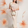 Casacca asimmetrica con paillettes e fiocco