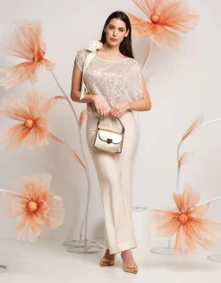 Casacca asimmetrica con paillettes e fiocco