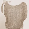 Casacca asimmetrica con paillettes e fiocco