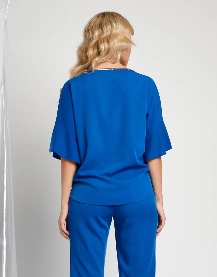 Casacca in tessuto fluido con cinturino e dettagli in lurex