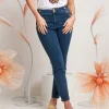 Jeans con bottoni oro in vita
