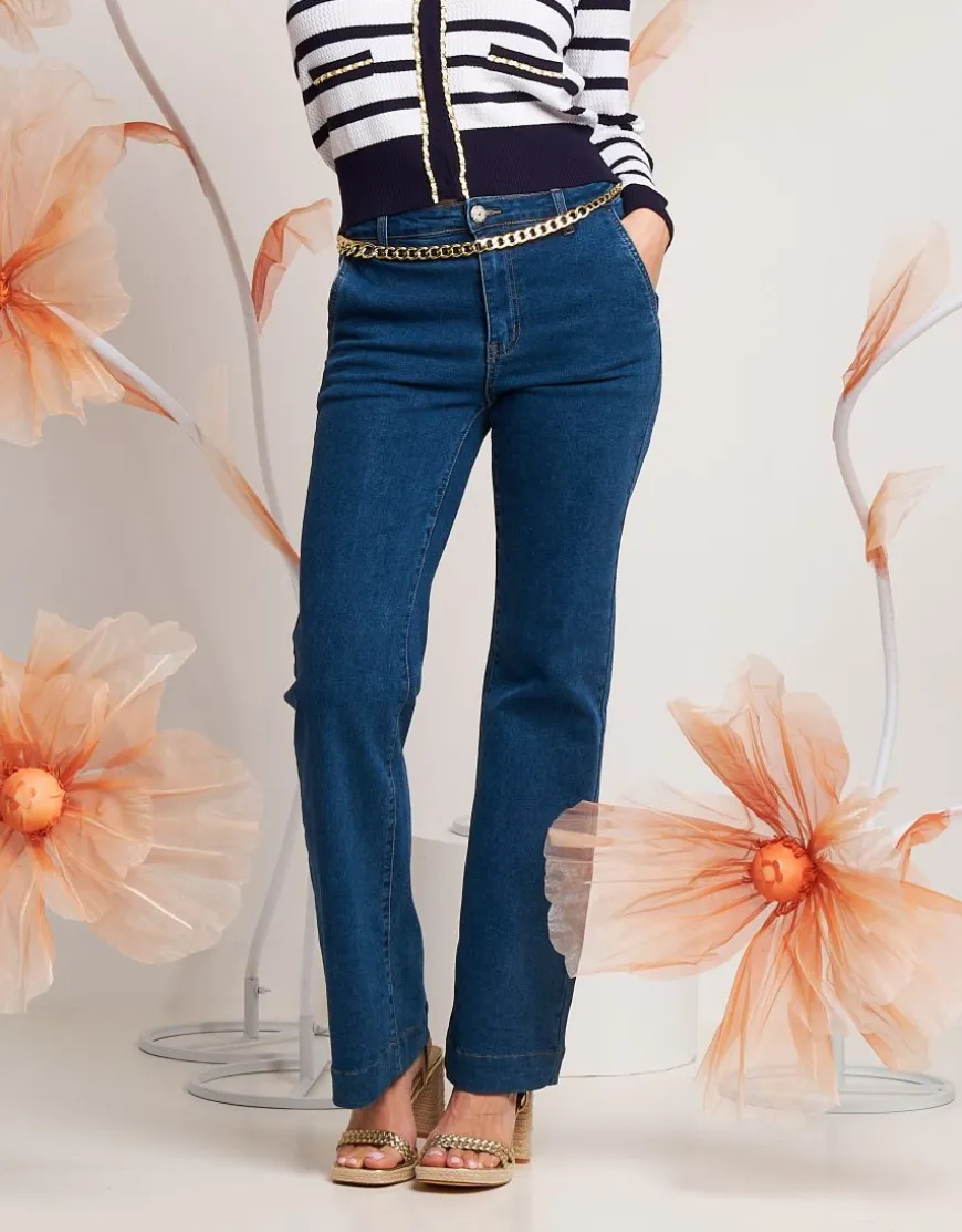 Jeans largo con tasche