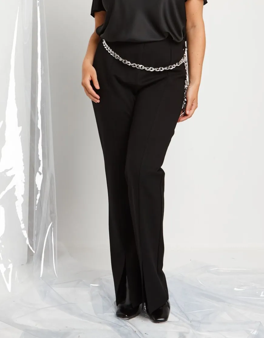 Pantalone a zampa con spacco e catena