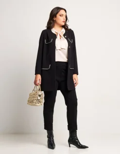 Pantalone con risvolto e pattine bordate