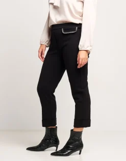 Pantalone con risvolto e pattine bordate