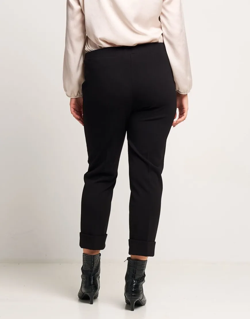 Pantalone con risvolto e pattine bordate