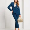 Pantalone con spacchi e bottoni sul fondo