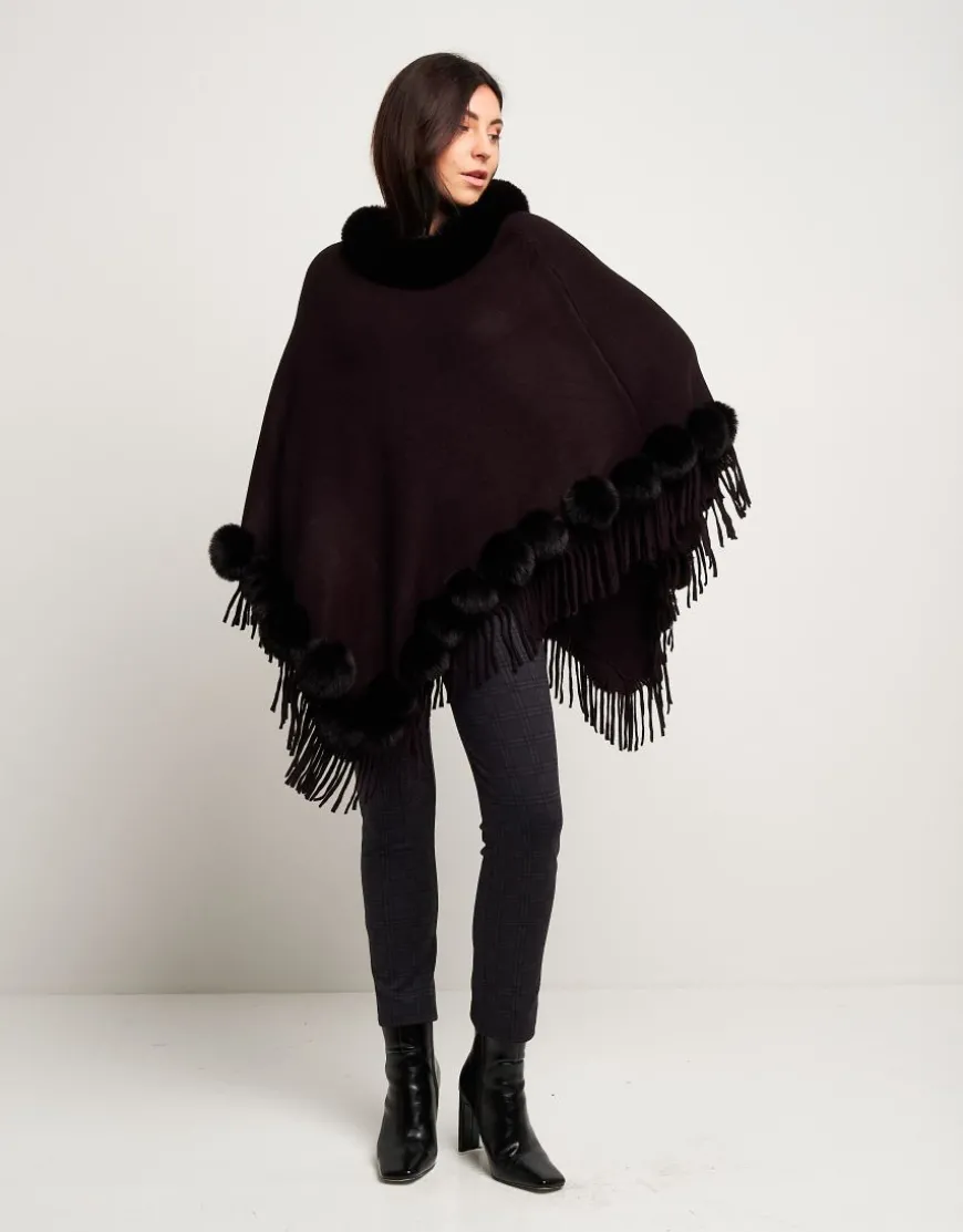 Poncho con pon-pon e frange