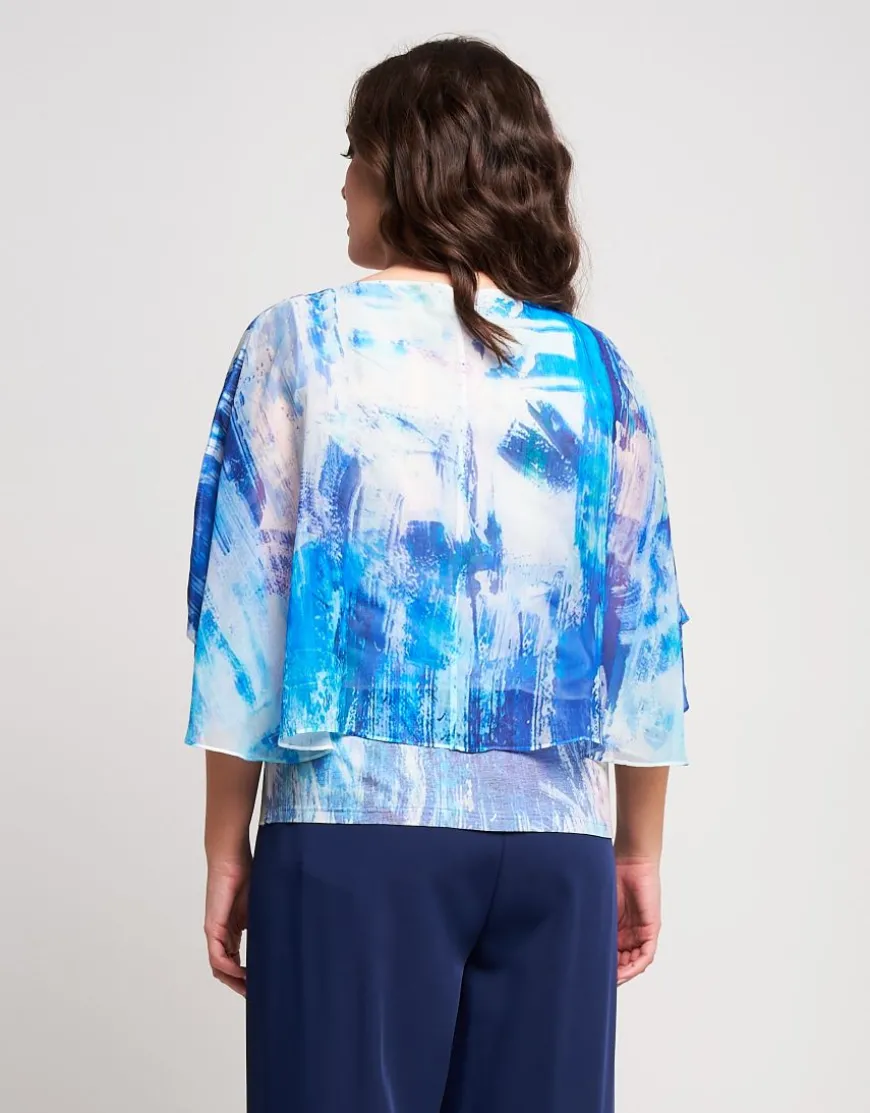 Poncho in georgette con fondo di paillettes