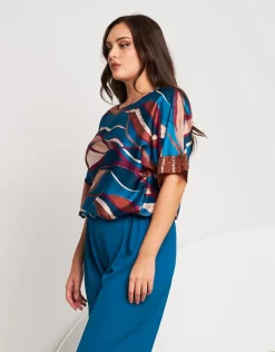 Poncho in raso con elastico e paillettes